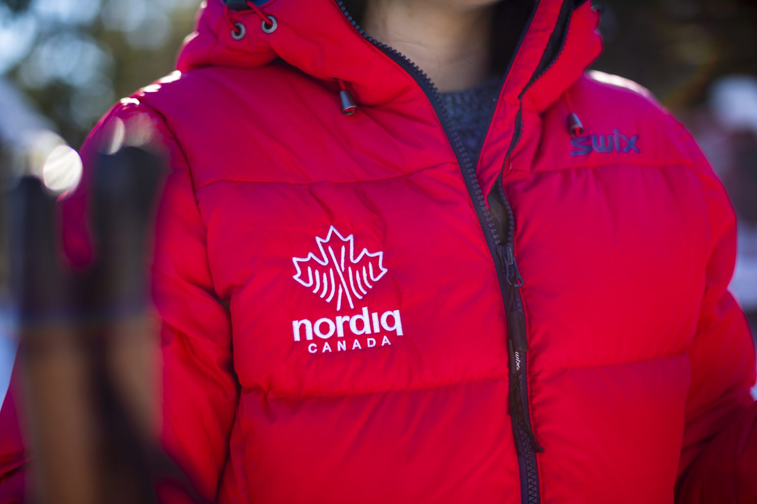 Nordiq Canada athlete wearing a red jacket